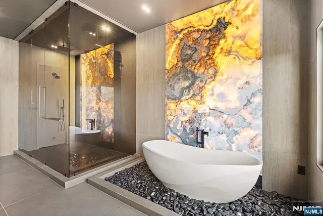 a bathroom with a bathtub and shower