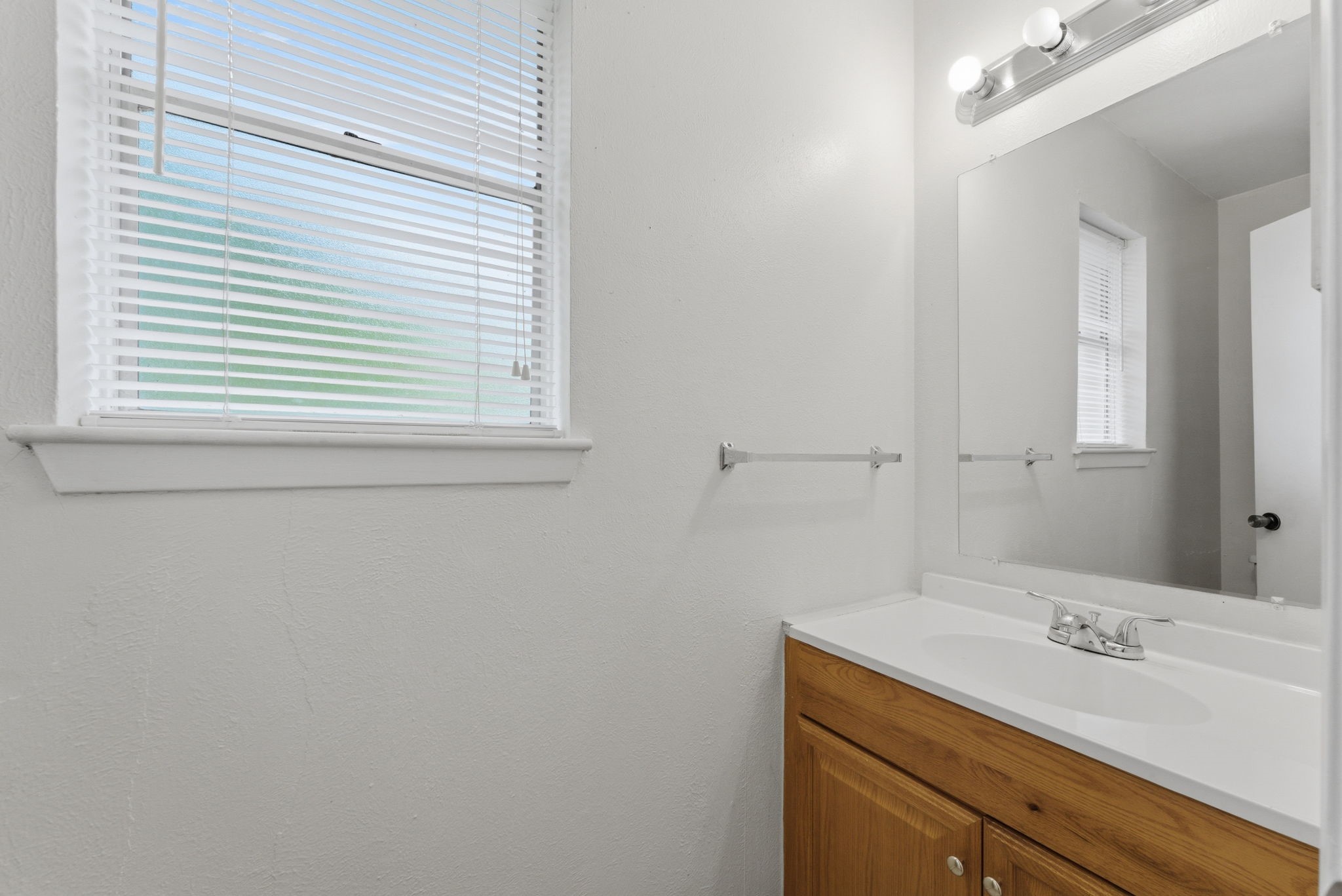 6914 Ten Curves Road Spring, TX 77379 - Photo 11 of 26 Half bath located off of the laundry room on first level.