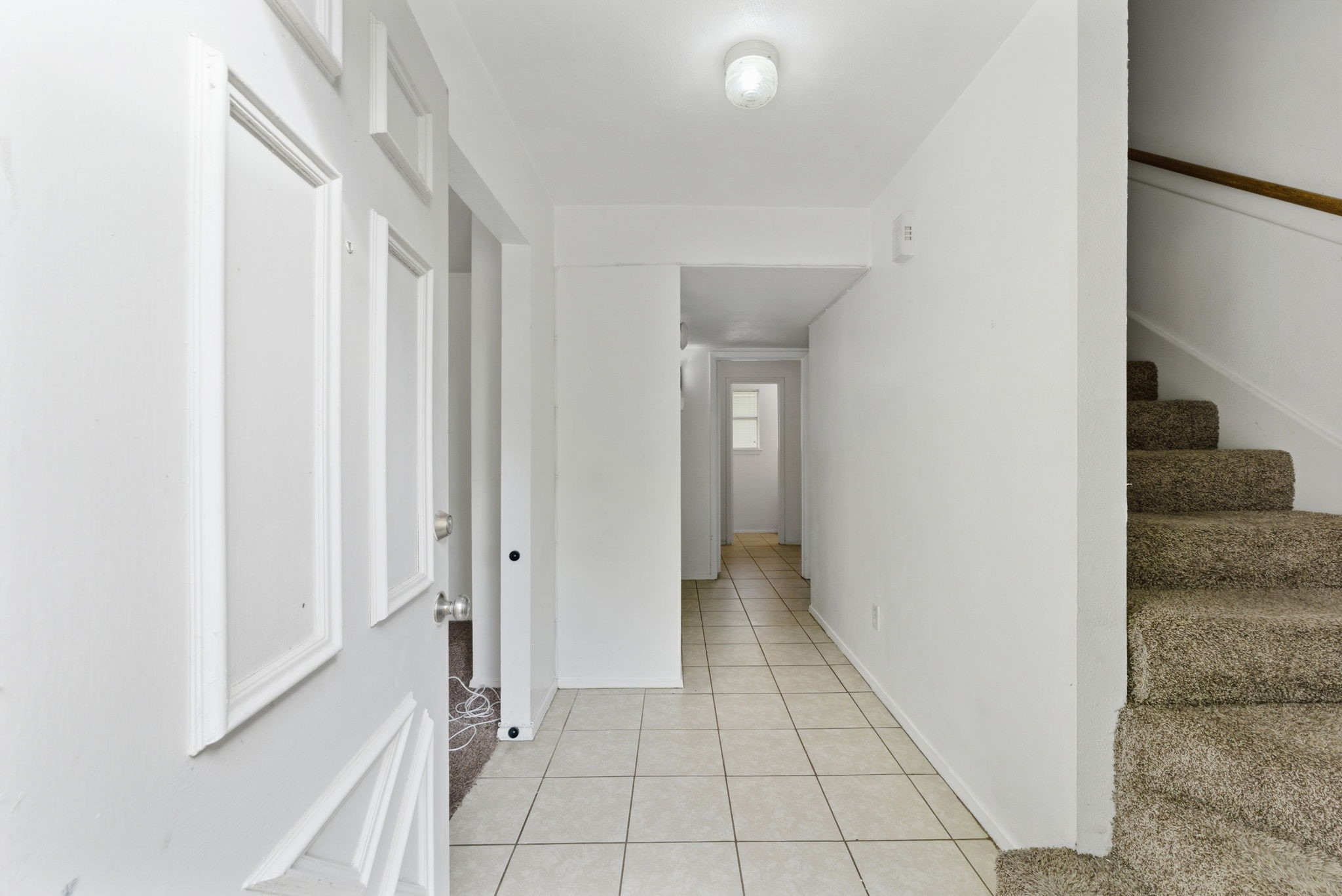 6914 Ten Curves Road Spring, TX 77379 - Photo 4 of 26 Entry with access to second floor and den.