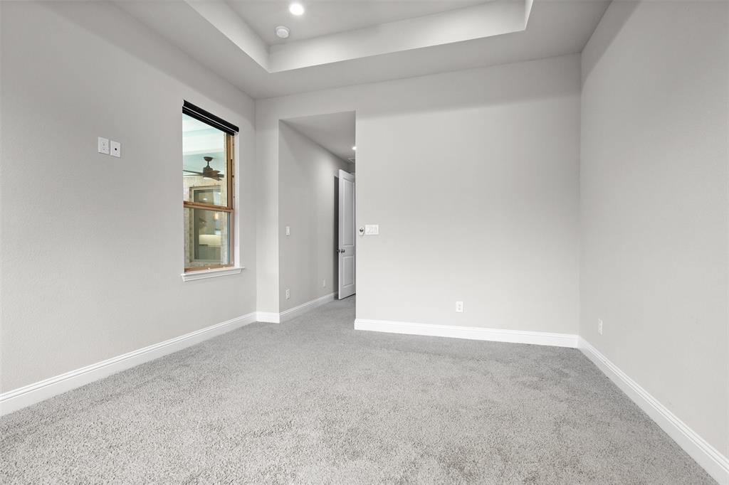 4505 Fall Mdw Drive Prosper, TX 75078 - Photo 15 of 34 an empty room with windows and closet