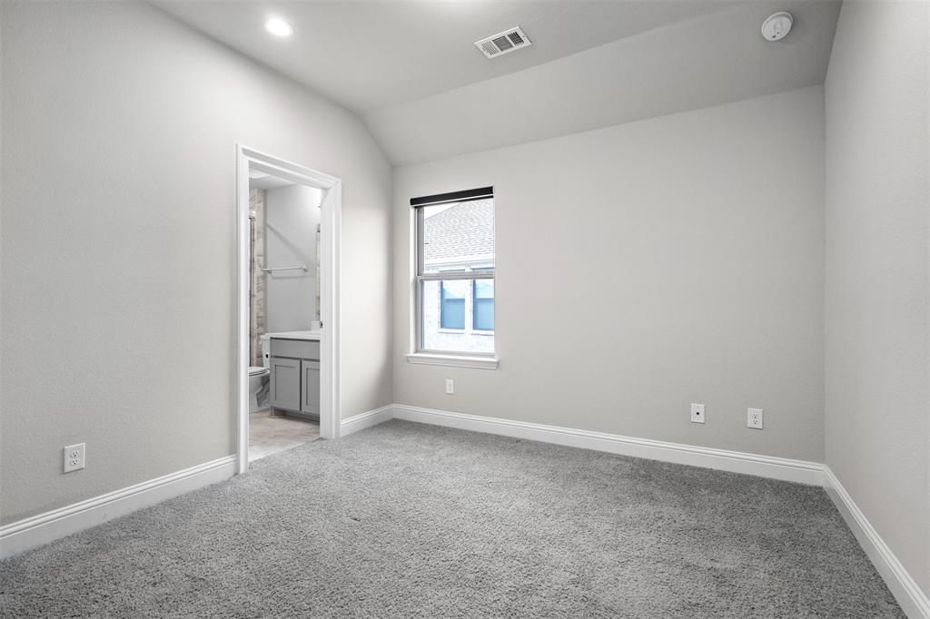 4505 Fall Mdw Drive Prosper, TX 75078 - Photo 18 of 34 an empty room with windows and closet