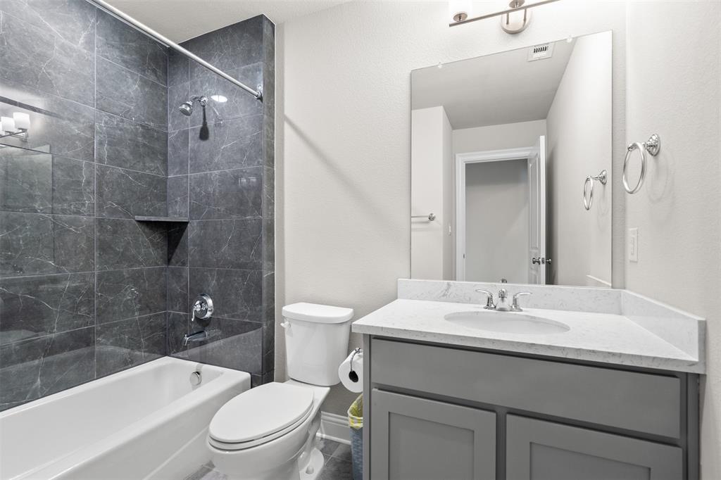 4505 Fall Mdw Drive Prosper, TX 75078 - Photo 21 of 34 a bathroom with a sink a toilet and shower