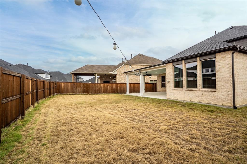 4505 Fall Mdw Drive Prosper, TX 75078 - Photo 28 of 34 a view of a house with wooden floor and fence