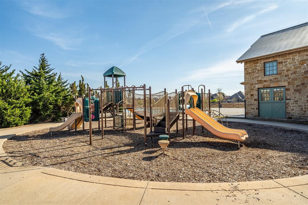4505 Fall Mdw Drive Prosper, TX 75078 - Photo 31 of 34 a view of a park with a slide