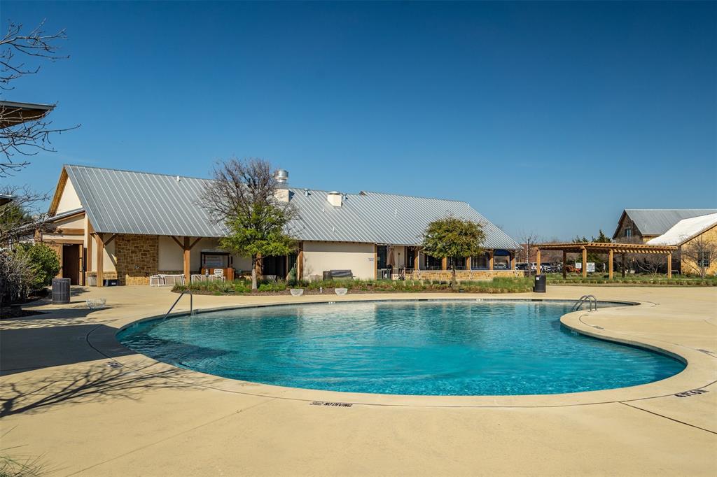 4505 Fall Mdw Drive Prosper, TX 75078 - Photo 32 of 34 a view of a swimming pool with outdoor seating