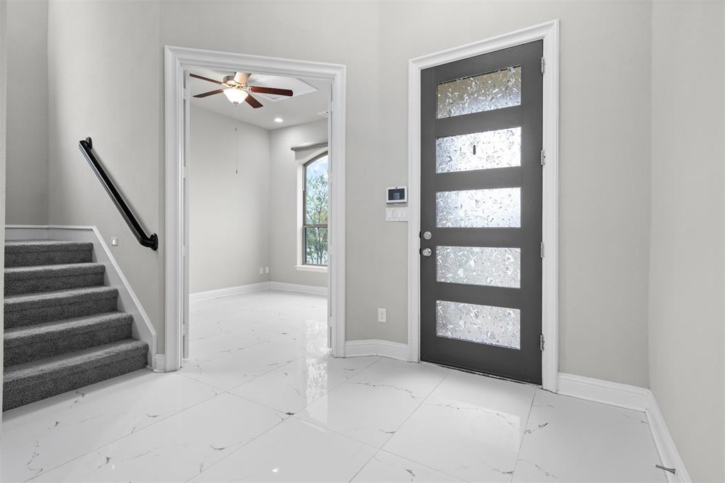 4505 Fall Mdw Drive Prosper, TX 75078 - Photo 4 of 34 a view of an entryway with stairs and a front door