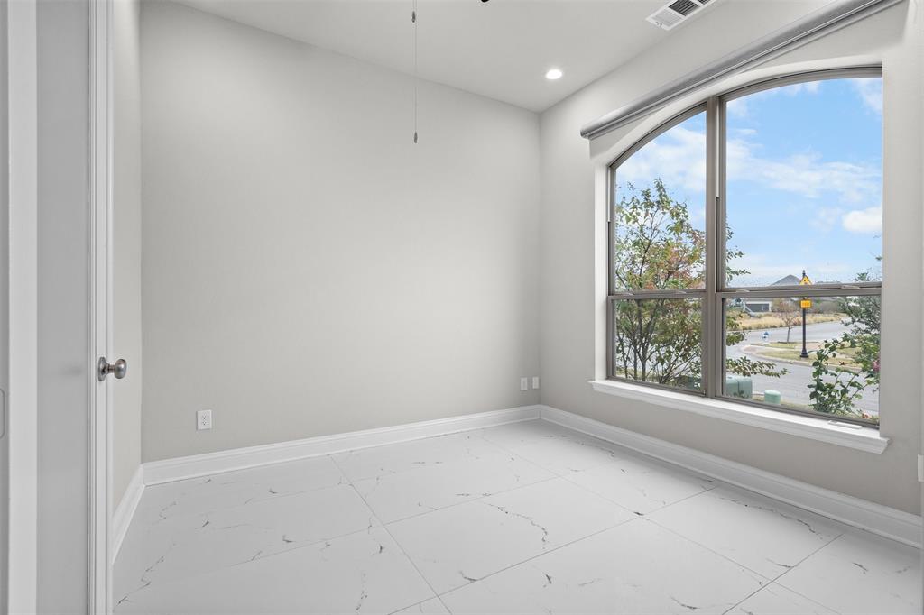 4505 Fall Mdw Drive Prosper, TX 75078 - Photo 5 of 34 a view of an empty room with a window