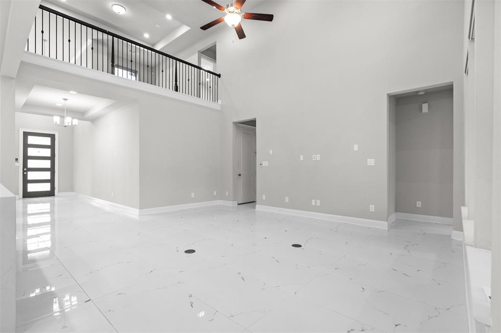 4505 Fall Mdw Drive Prosper, TX 75078 - Photo 7 of 34 wooden floor in an empty room with a window
