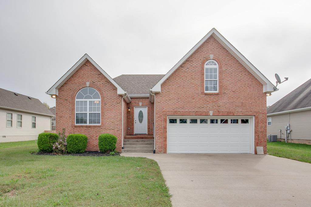 144 Fieldstone Lane Springfield, TN 37172 - Photo 1 of 24 a front view of a house with a yard and garage