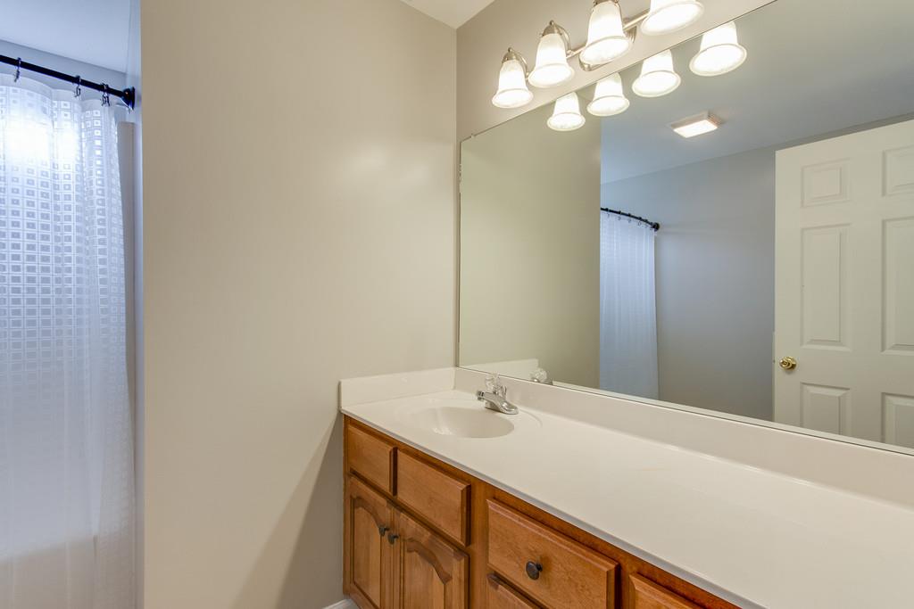144 Fieldstone Lane Springfield, TN 37172 - Photo 12 of 24 a bathroom with a sink vanity and a mirror