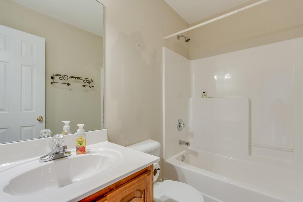 144 Fieldstone Lane Springfield, TN 37172 - Photo 16 of 24 a bathroom with a sink mirror toilet and bathtub