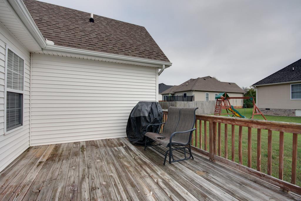 144 Fieldstone Lane Springfield, TN 37172 - Photo 19 of 24 a view of a roof deck with wooden floor and fence