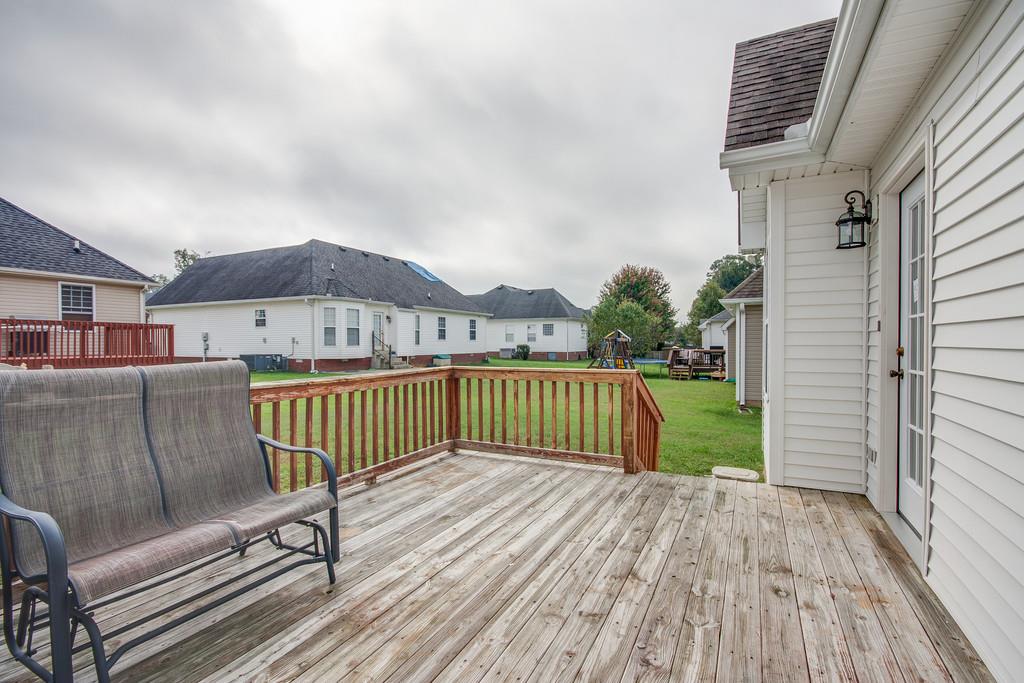 144 Fieldstone Lane Springfield, TN 37172 - Photo 20 of 24 a view of a deck with chair and wooden floor