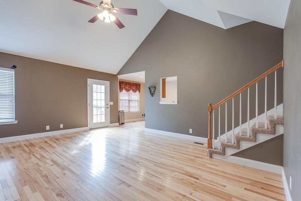 144 Fieldstone Lane Springfield, TN 37172 - Photo 5 of 24 a view of an empty room with wooden floor and a window