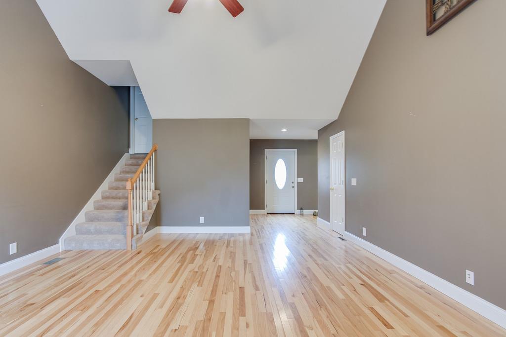 144 Fieldstone Lane Springfield, TN 37172 - Photo 6 of 24 a view of a room with wooden floor and staircase