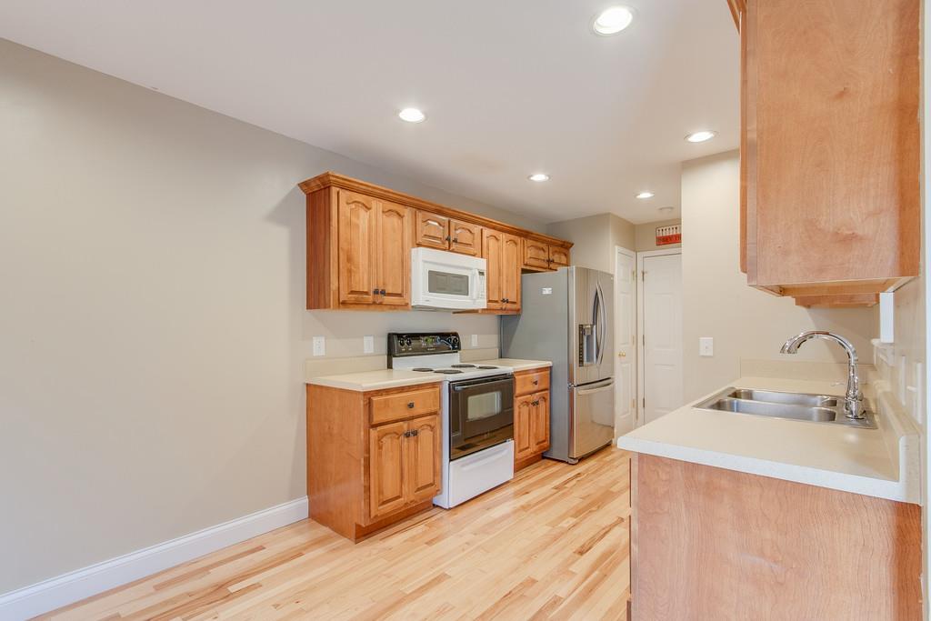 144 Fieldstone Lane Springfield, TN 37172 - Photo 7 of 24 a kitchen with a sink stove and refrigerator