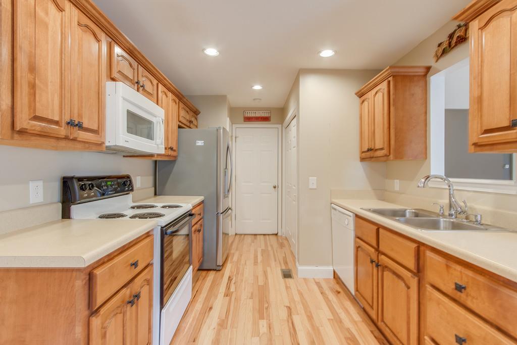 144 Fieldstone Lane Springfield, TN 37172 - Photo 9 of 24 a kitchen with stainless steel appliances granite countertop a sink stove and refrigerator
