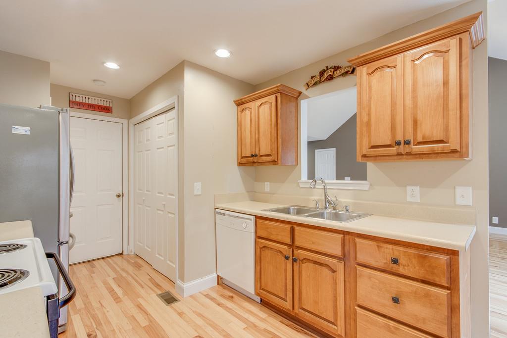 144 Fieldstone Lane Springfield, TN 37172 - Photo 10 of 24 a kitchen with a sink cabinets and wooden floor