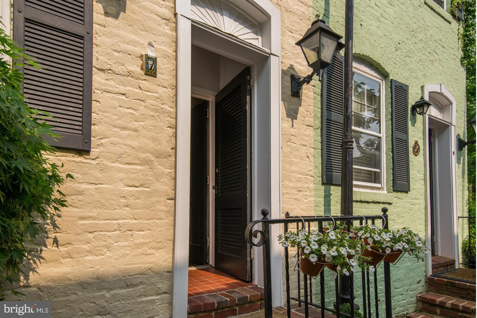 7 Pomander Walk Northwest Washington, DC 20007 - Photo 2 of 23 a view of a door of the house