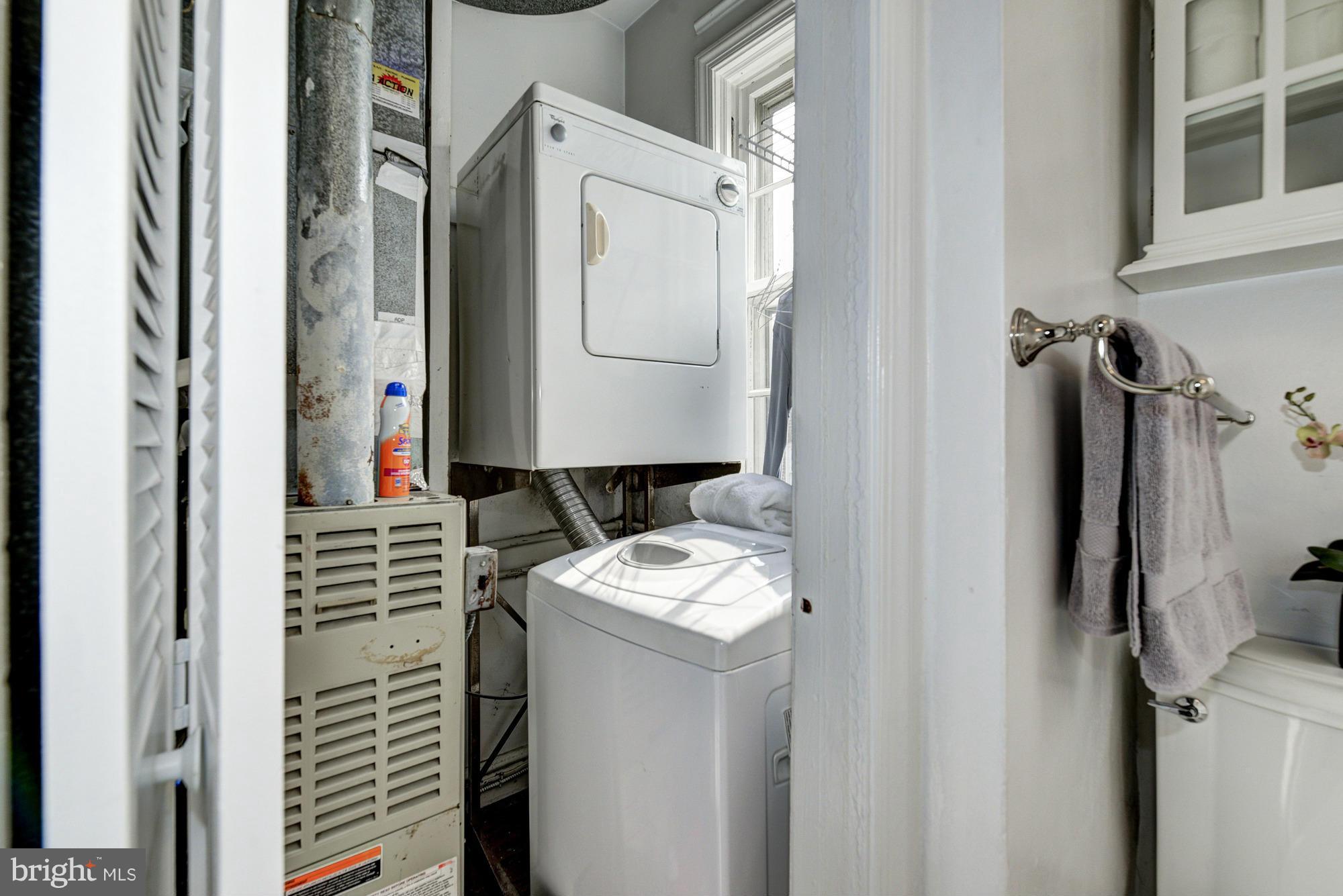 7 Pomander Walk Northwest Washington, DC 20007 - Photo 11 of 23 a bathroom with a granite countertop sink and a mirror