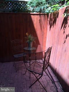 7 Pomander Walk Northwest Washington, DC 20007 - Photo 12 of 23 a view of a chairs and table in patio