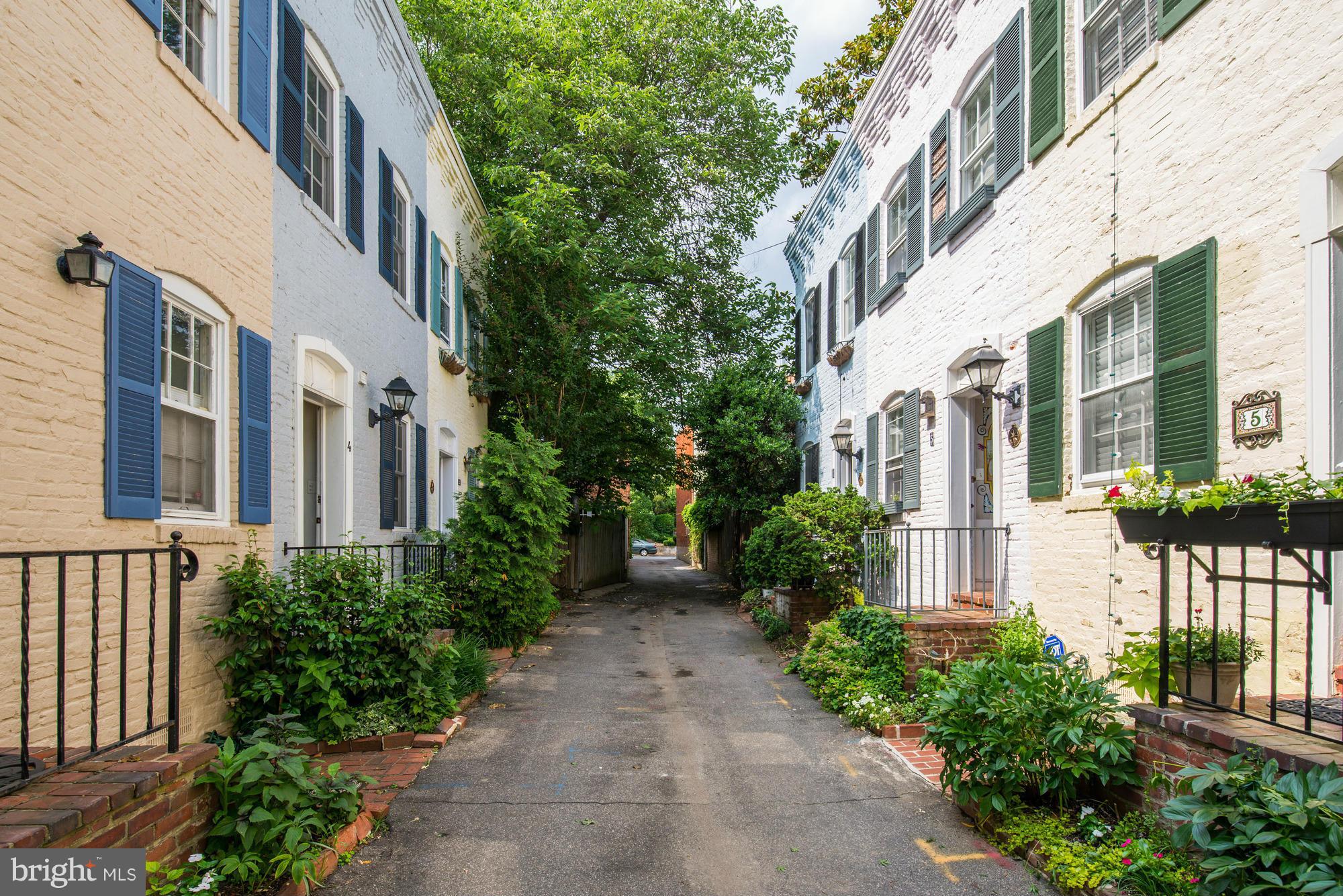 7 Pomander Walk Northwest Washington, DC 20007 - Photo 16 of 23 a view of a pathway both side of house