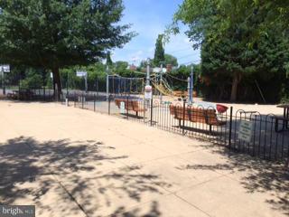 7 Pomander Walk Northwest Washington, DC 20007 - Photo 20 of 23 a outdoor space with lots of trees and slides