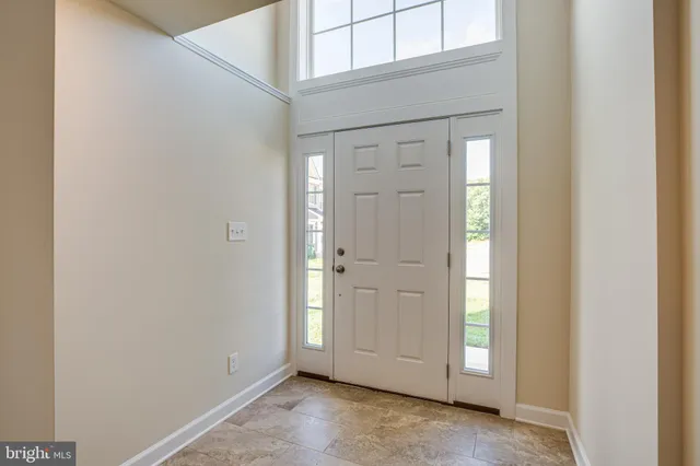 a view of an empty room and a window