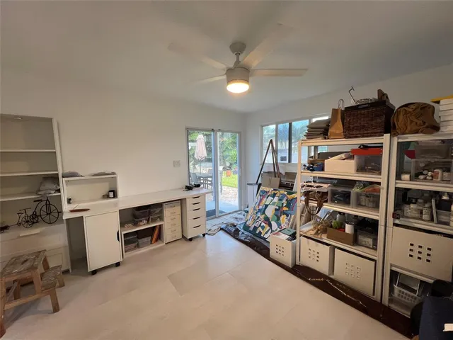 a view of a workspace with furniture