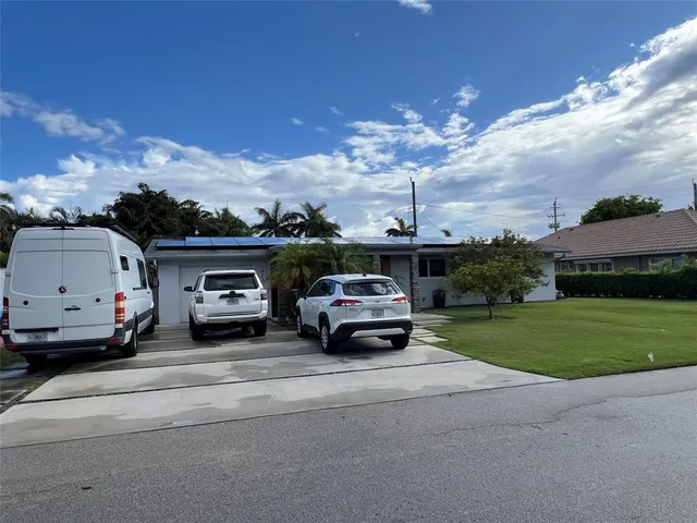 a view of a car in front of a house