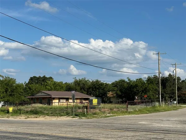 a view of a big yard next to a road