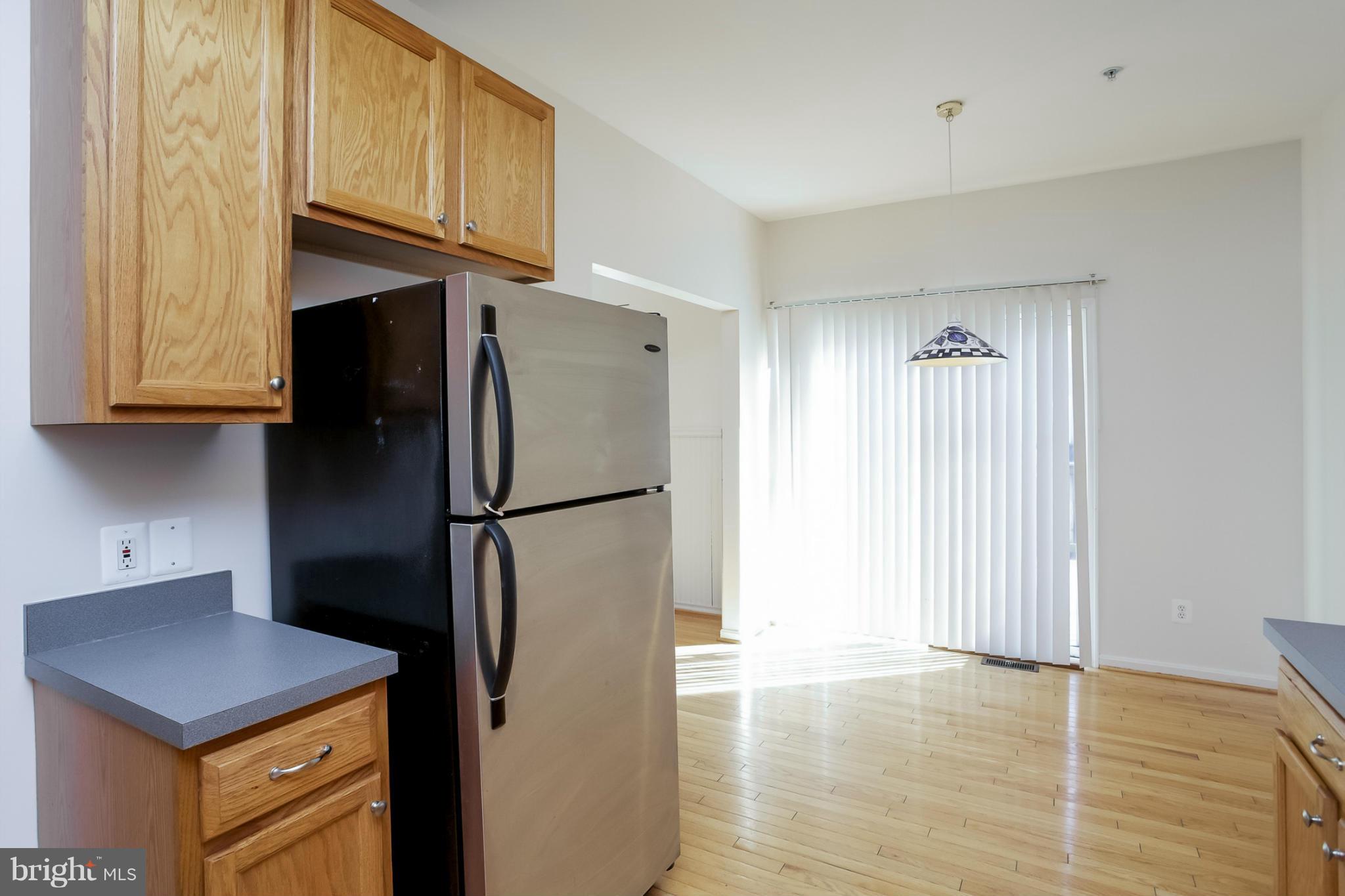 4130 Cutty Sark Road Baltimore, MD 21220 - Photo 14 of 24 a kitchen with stainless steel appliances a refrigerator and a stove top oven