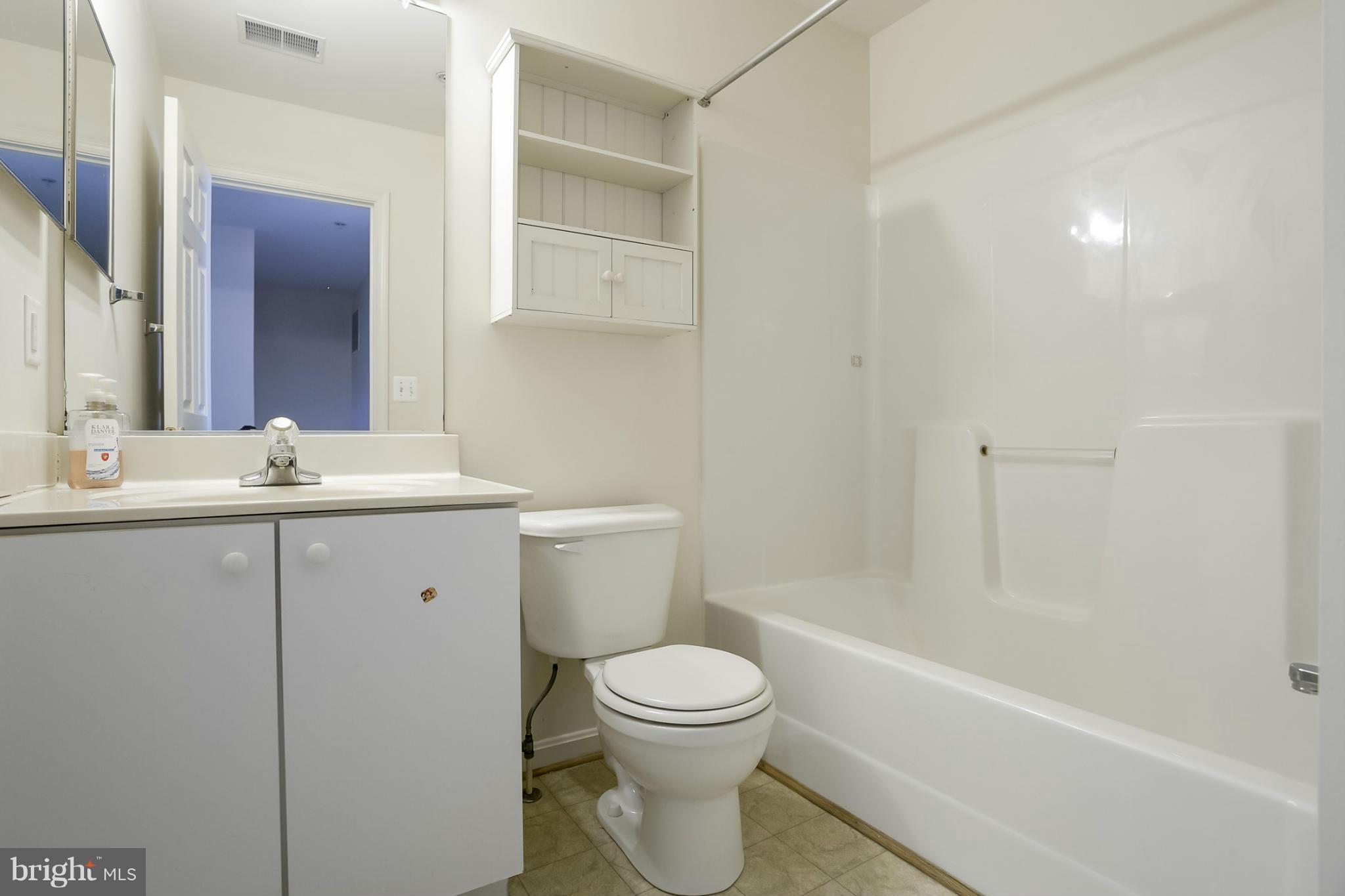 4130 Cutty Sark Road Baltimore, MD 21220 - Photo 17 of 24 a bathroom with a sink a toilet and shower