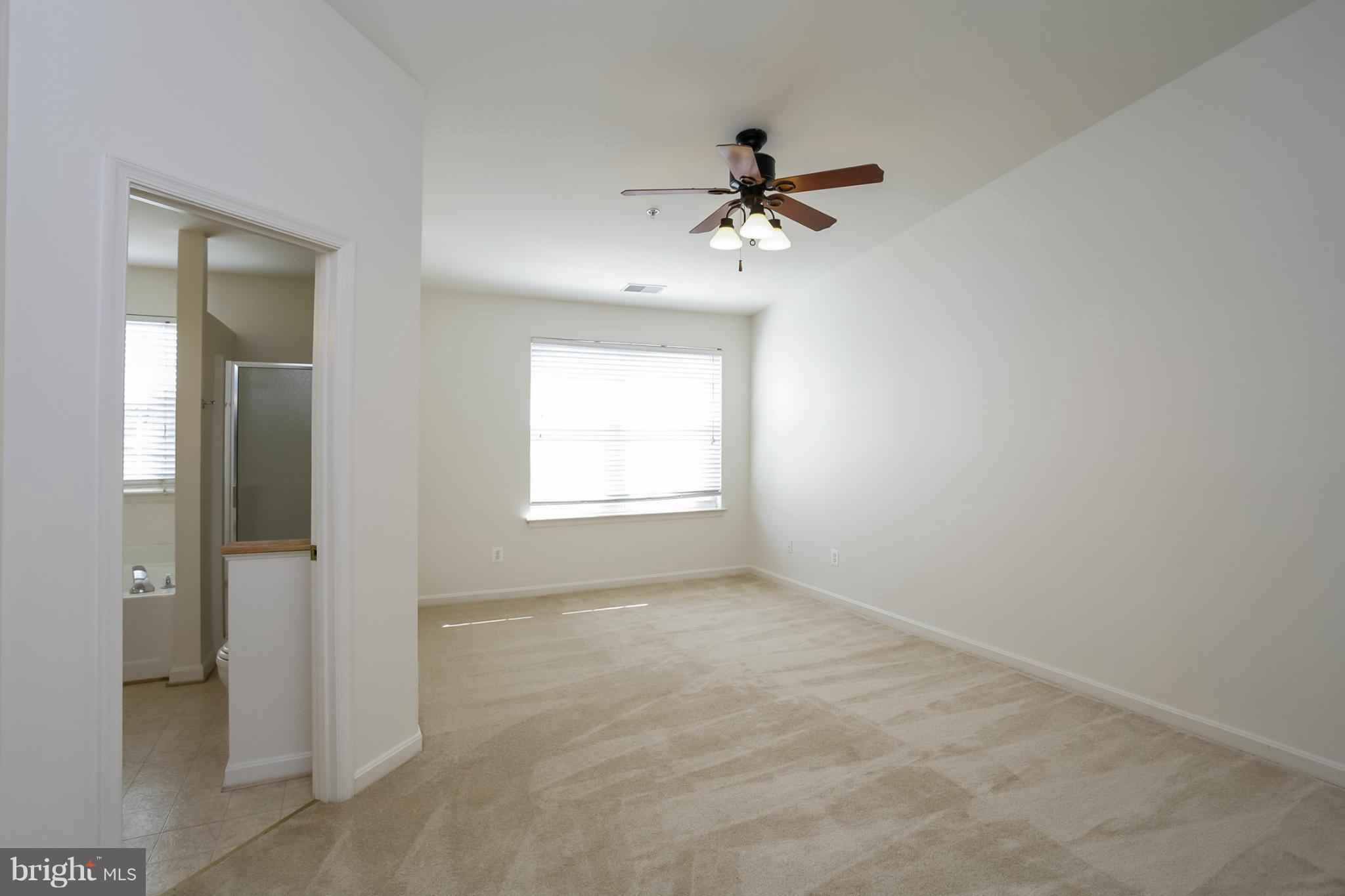 4130 Cutty Sark Road Baltimore, MD 21220 - Photo 20 of 24 wooden floor in an empty room with a window