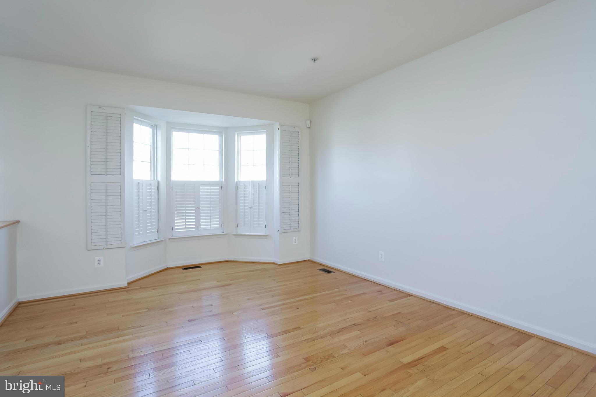 4130 Cutty Sark Road Baltimore, MD 21220 - Photo 7 of 24 a view of empty room with wooden floor and fan