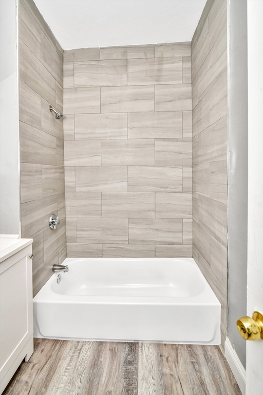 352 Norfolk Street, Unit 3 Boston, MA 02124 - Photo 5 of 12 a bathroom with a bathtub and shower