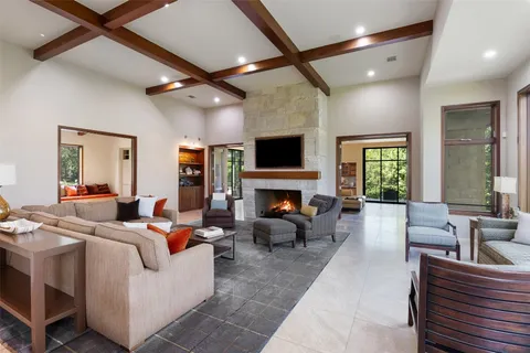 a view of a yard with wooden fence and trees
