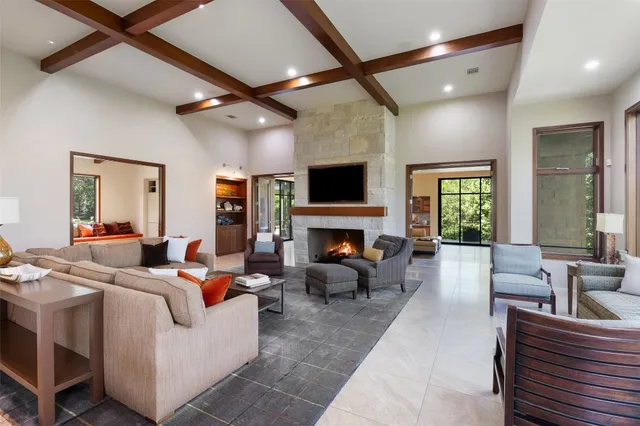 a view of a yard with wooden fence and trees