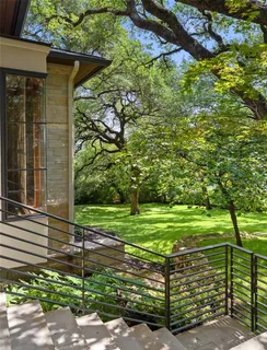 a bedroom with a large bed and a fireplace