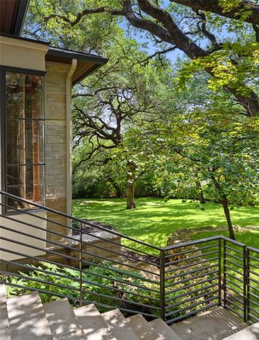 a bedroom with a large bed and a fireplace