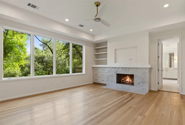 a spacious bathroom with a granite countertop sink mirror and double