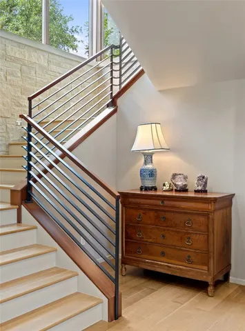 a front view of a house and wooden floor in windows