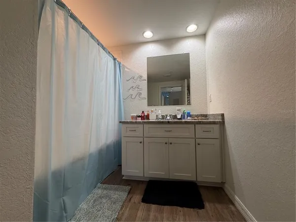 a bathroom with a sink a mirror and a toilet