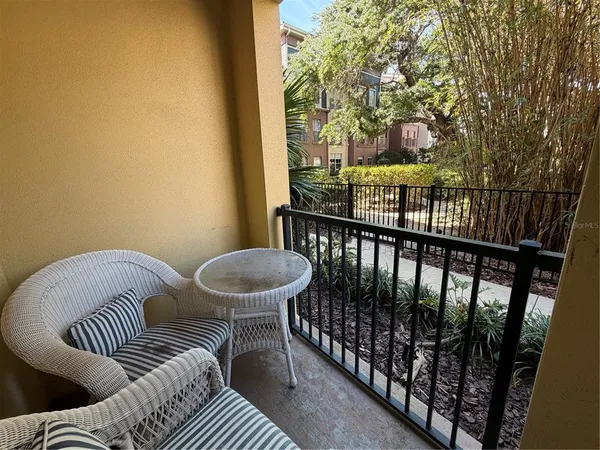 a view of a balcony with furniture