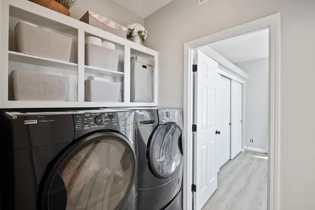 a view of livingroom with washer and dryer
