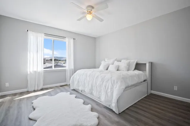 a bedroom with a bed and window