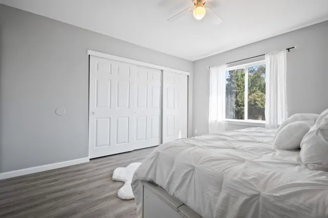 a bathroom with a sink toilet vanity and tub