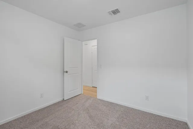 a bathroom with a sink toilet vanity and shower