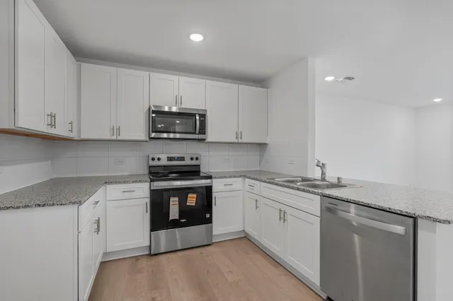 a kitchen with a stove and a microwave