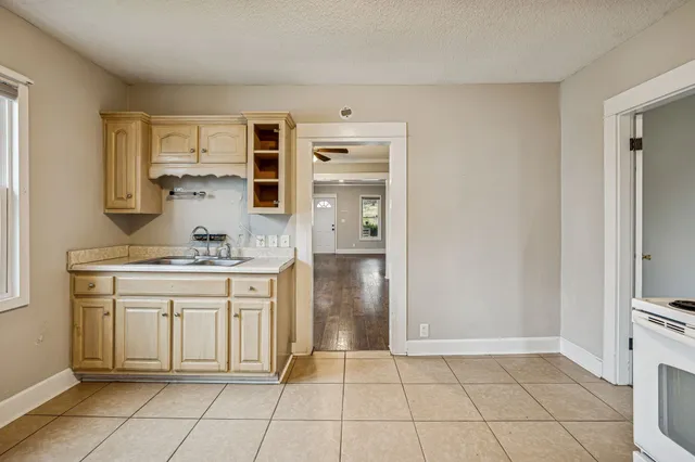 a kitchen with stainless steel appliances granite countertop a sink and cabinets